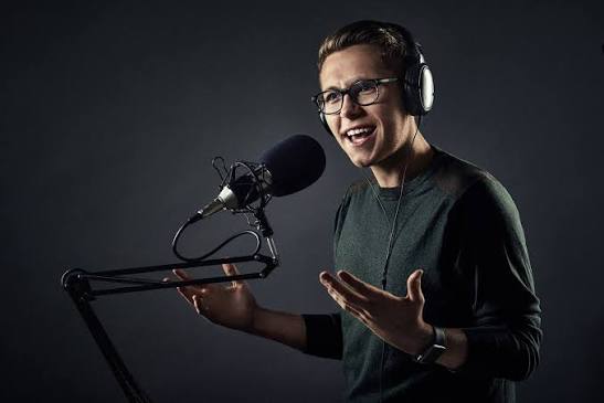 Podcast host at the microphone